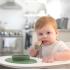 Обучителна силиконова купа с вградена вакуумна подлжка Ezpz 4 + месеца Tiny Bowl Olive
